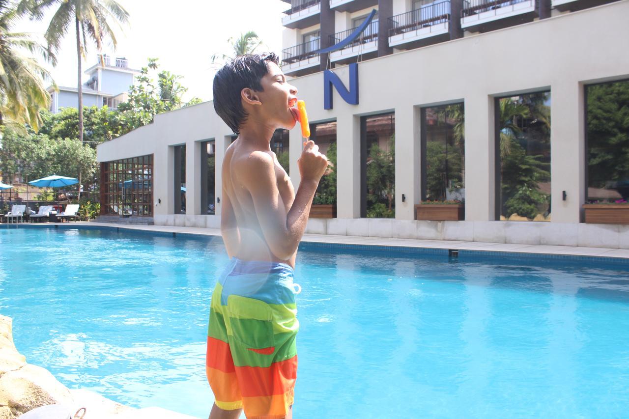 Novotel Goa Candolim Exterior photo A child eating an ice cream